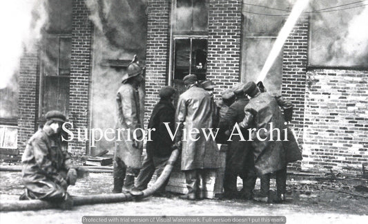 Old Time Firemen Fighting A Fire Six Fire Fighters On Hose Petoskey MI 1920