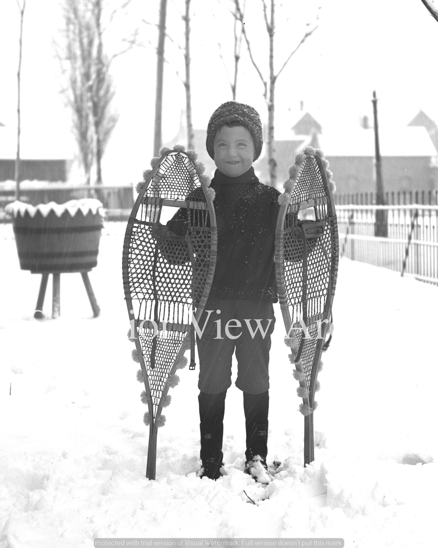 Young Boy Posing with Snowshoes